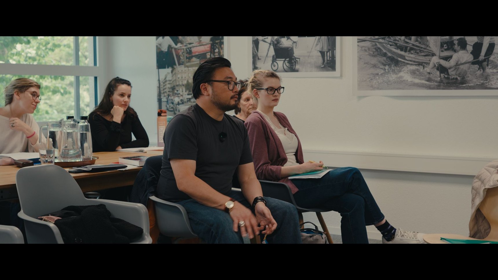 Attentive group of actors during a class at Arthouse Acting Studio, in a light-filled room.