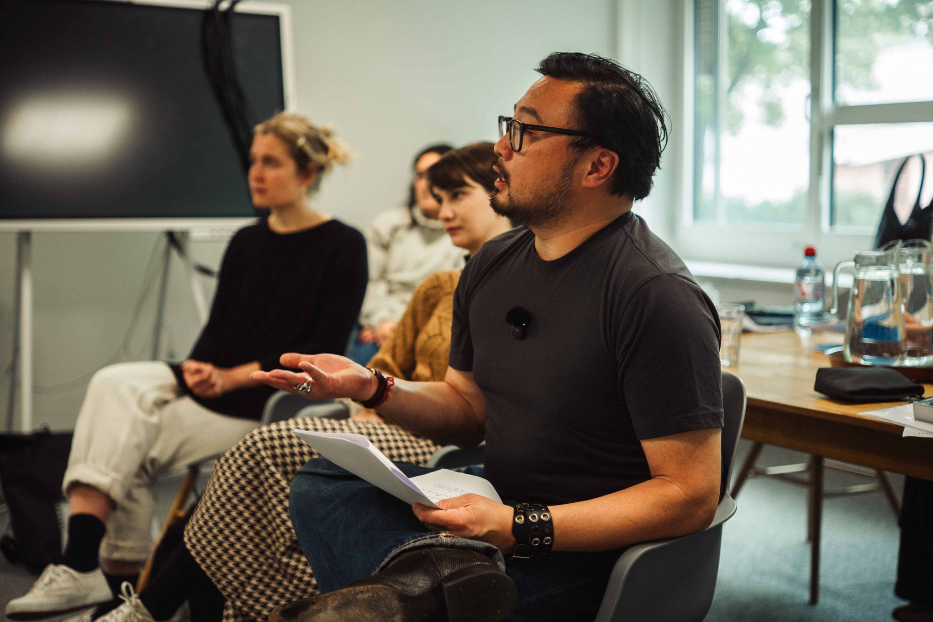 Christophe Tek giving feedback to the group during a class.
