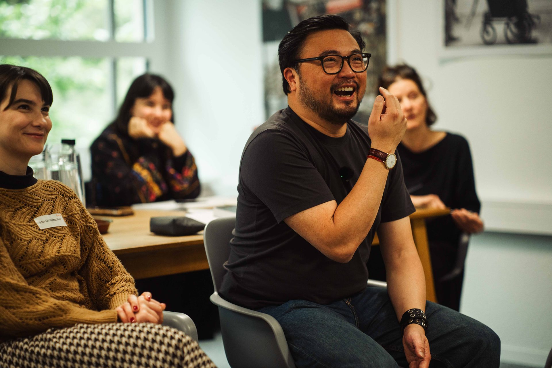 Christophe Tek laughing with participants during a class.